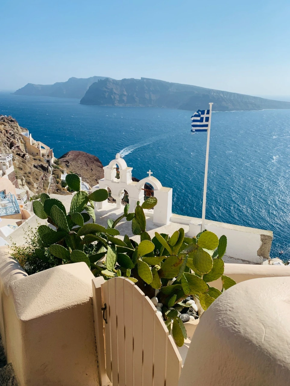 a view of a greek island from a balcony